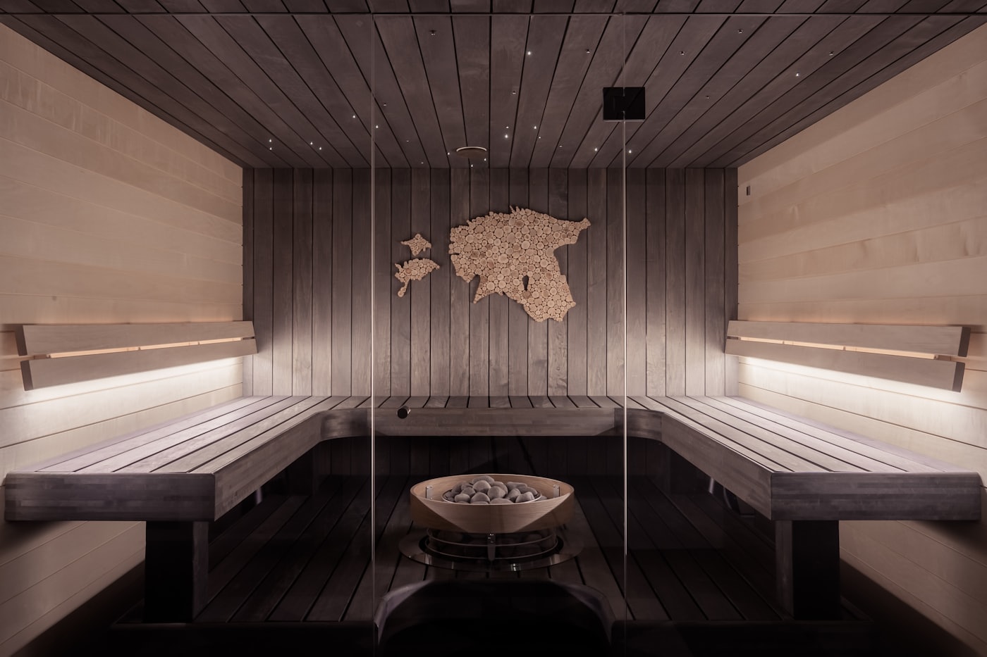 Lit candle and stones in a serene spa setting