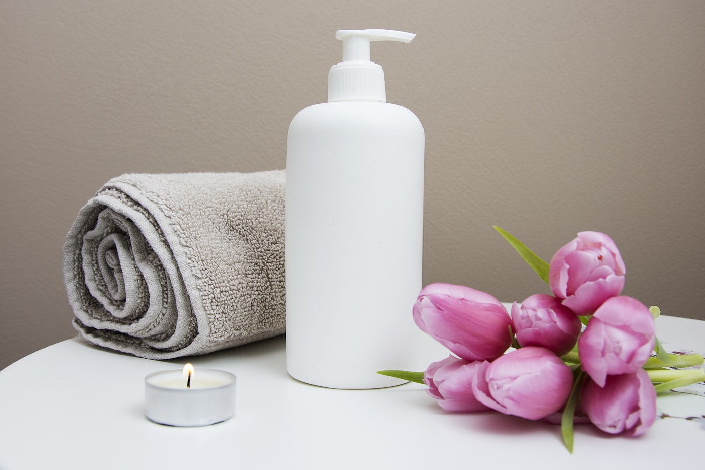 Spa towels and candles in a calm setting